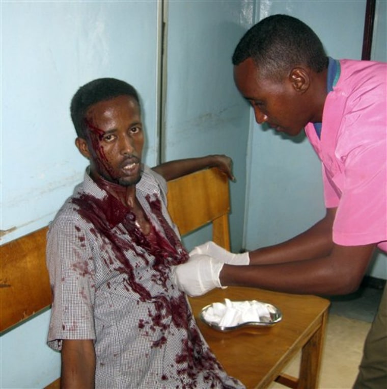 A nurse at Medina hospital treats a wounded civilian in Mogadishu, Somalia, on Tuesday after he was wounded by mortar shrapnel during fighting between Somali insurgents and African Union troops.